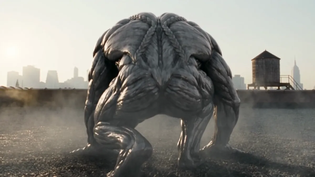Crouched on a rooftop, fully covered below the neck